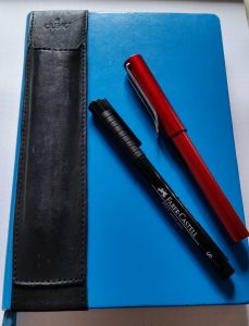 Notebook and pens (with optional penholder)